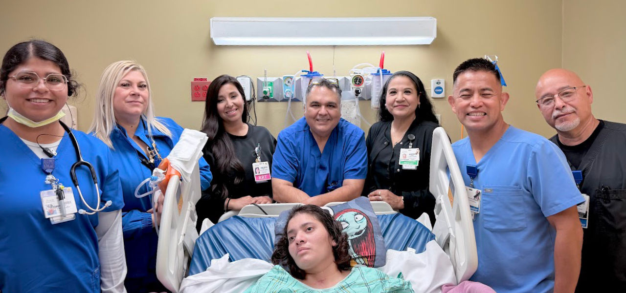 Solara Specialty Hospital Harlingen patient Eveline poses with her care team 